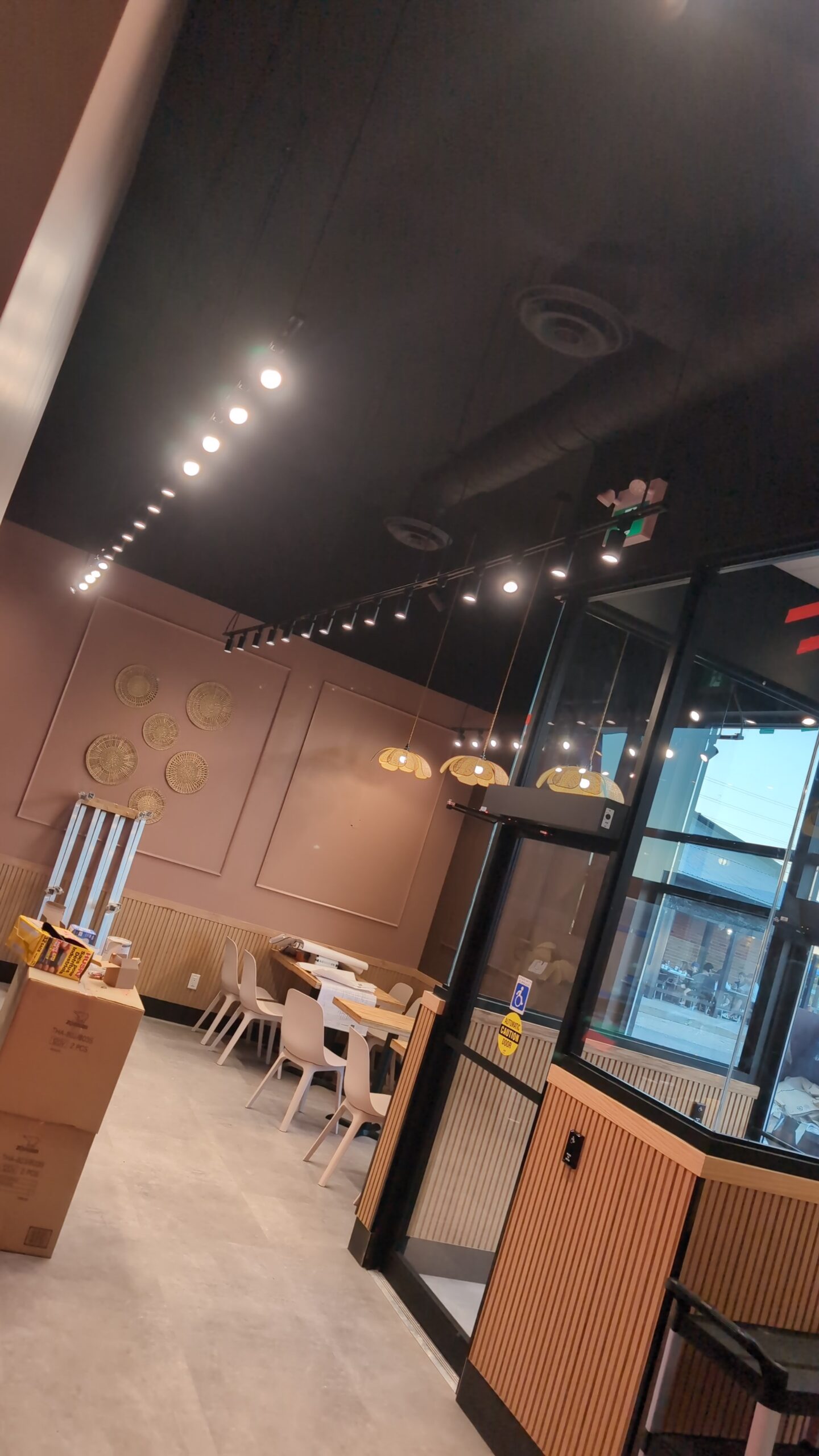 Track and pendant lights over the dining area at Thai Express in Brockville.