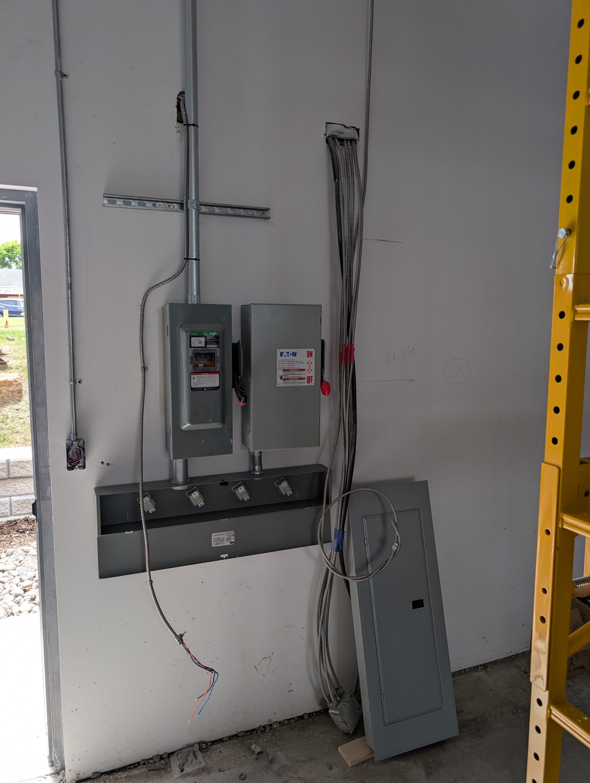 Electrical distribution equipment and cable runs during rough-in at Thai Express in Brockville.