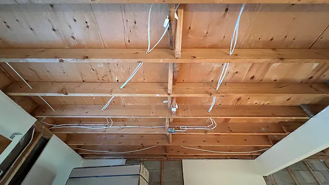 Open-ceiling electrical rough-in during the Renforth Drive full-gut renovation