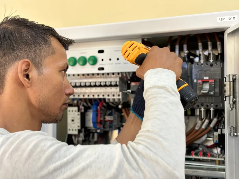 Electrician working on a residential electrical panel.