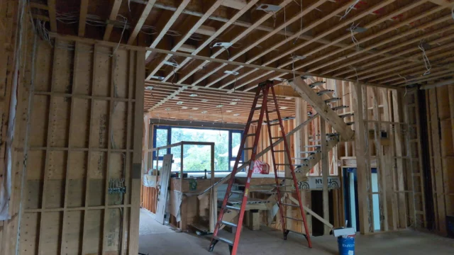 Davies Crescent custom-home electrical rough-in with open framing and ladder